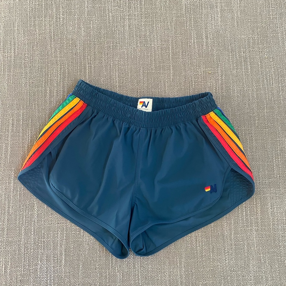 Aviator Nation Women’s 5 Stripe Flex Board Shorts, Navy/Rainbow